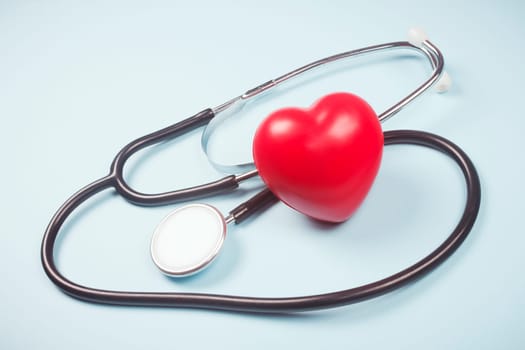 Red heart and stethoscope are symbol of cardiology, health of cardiovascular system, healthcare and medicine concept.