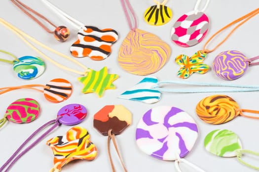 Colorful handmade trinket from modeling clay for children.