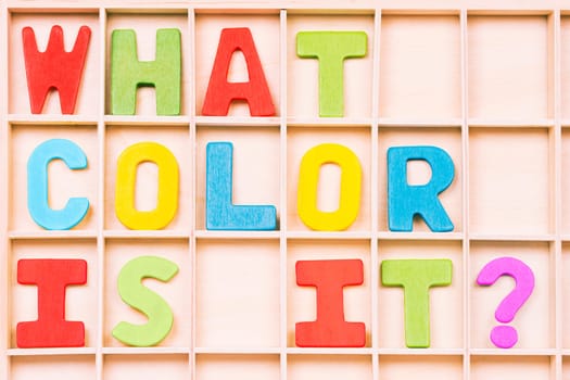 WHAT COLOR IS IT? text from different colors on wooden board, learning colors for kids.