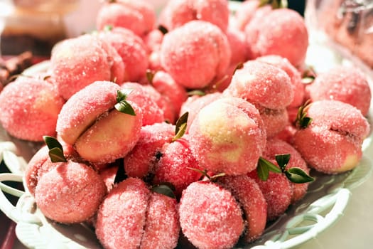 The special confectionery product, the peaches with sugar are dessert sweet food.