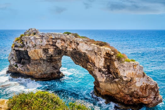 Beautiful natural rock arch at viewpoint, Mirador Es Pontas, island of Mallorca, Balearic islands, Spain
