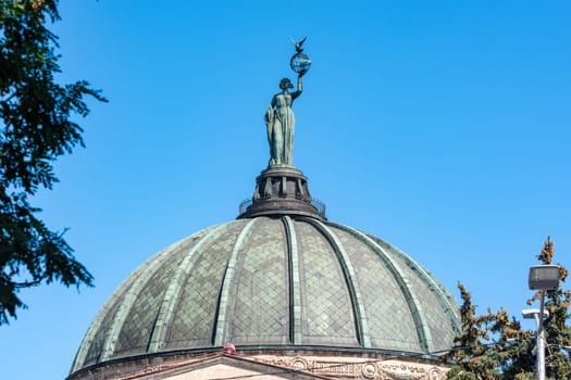 Volgograd, Russia - August 26, 2019: Dome with a statue on the building of the Volgograd Planetarium