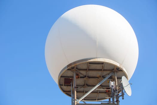 Meteorological radar station on the top of Sierra de Fuentes, Spain. Dome over blue sky