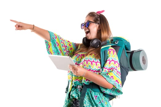 Hiker girl with tablet isolated in white, trekking and travel lifestyle concept