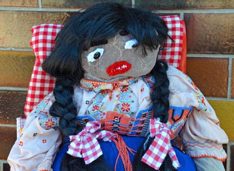 straw doll in costume