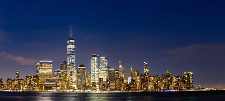 New York city Lower Manhattan skyline cityscape at dusk from New Jersey.