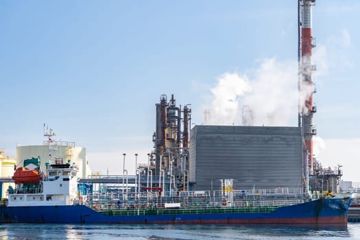Tanker boat loading fuel from oil Chemical Factory in Kawasaki Japan