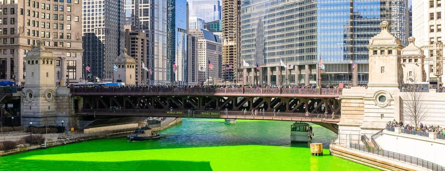 Chicago, IL - Mar 16, 2019: The annual Chicago St. Patrick's Day tradition of dying the Chicago river green in Chicago downtone on Mar 16,2019. This has been organized by the local Plumbers Union since 1962.