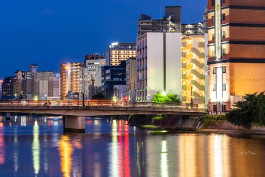 Fukuoka old town along naka river at Nakasukawabata sunset twilight. This area is favorite for tourist for Fukuoka Yatai, street Food stall,  for hangout at night.