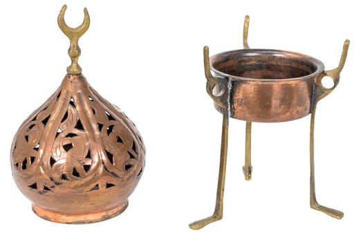 Old oriental incense burner made of copper, taken apart in 2 parts isolated on white