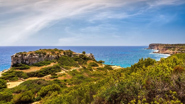 Panorama of beautiful beach and bay with turquoise sea water, Cala des Moro, Santanyi, Mallorca island, Spain