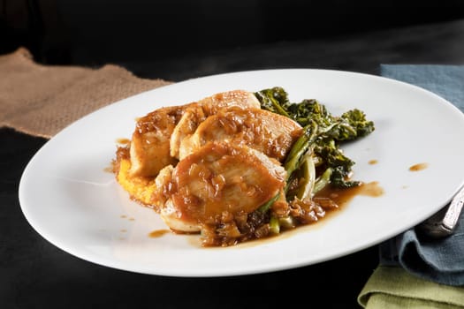 Chicken breast medallions with shallot marsala gravy, polenta and broccoli rabe