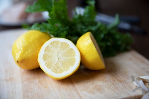 Whollr and halved lemons on cutting board