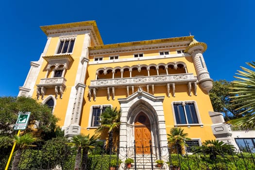 Facade of Lencastre House, a palace built in early 20th century in eclectic summer architecture with arab, neo-Manueline and neo-Gothic motifs, in Cascais, Portugal