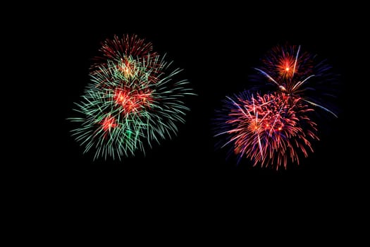 abstract Fireworks light up the dark sky background