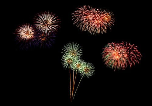 abstract Fireworks light up the dark sky background