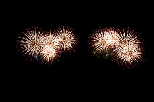 abstract Fireworks light up the dark sky background