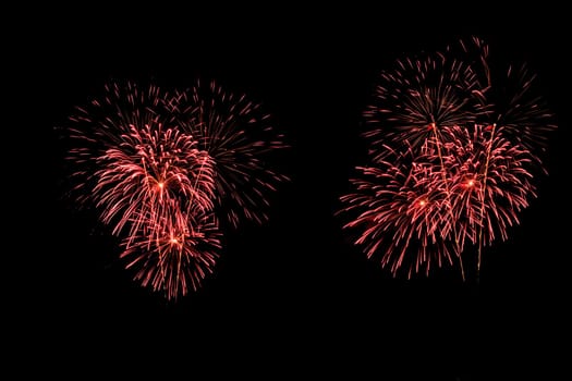 abstract Fireworks light up the dark sky background