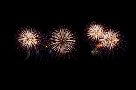 abstract Fireworks light up the dark sky background