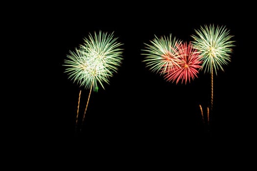 abstract Fireworks light up the dark sky background