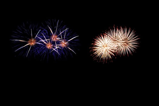 abstract Fireworks light up the dark sky background