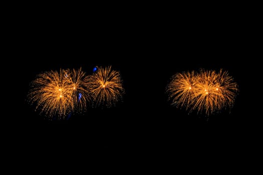 abstract Fireworks light up the dark sky background
