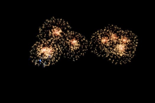 abstract Fireworks light up the dark sky background