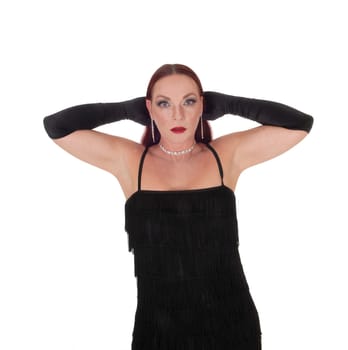 A close up portrait image of beautiful woman with her red hear in the.back and a necklace, with hands behind her head, isolated for white .background.
