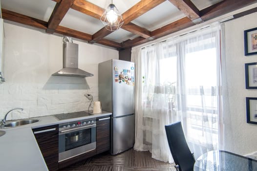 Russia, Moscow- May 16, 2019: interior room apartment. standard repair decoration in hostel. kitchen and dining room