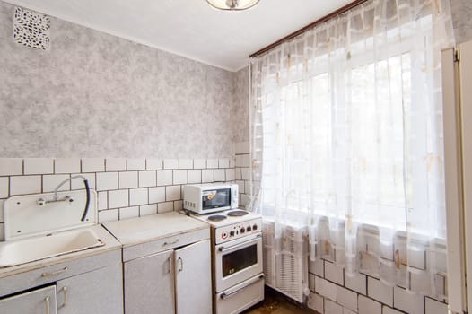 Russia, Moscow- May 16, 2019: interior room apartment. standard repair decoration in hostel. kitchen and dining room