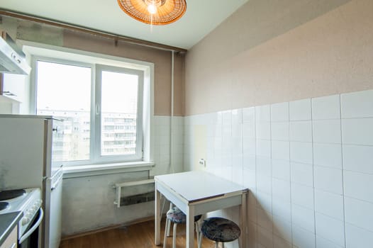 Russia, Moscow- May 16, 2019: interior room apartment. standard repair decoration in hostel. kitchen and dining room