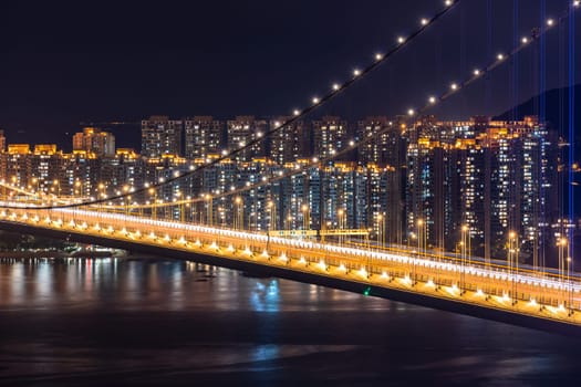 Sunset and light illumination of Tsing ma bridge landmark suspension bridge in Tsing yi area of Hong Kong China.