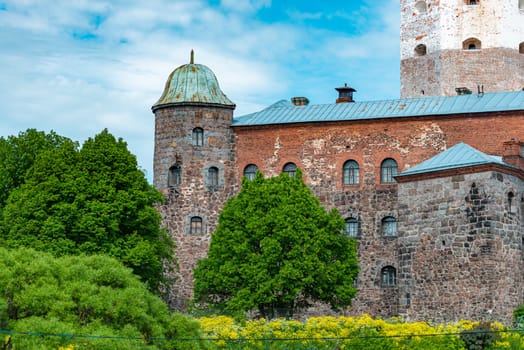 Architecture of old town Vyborg, Russia, Europe. Saint Olaf tower and Vyborg castle on summer day.