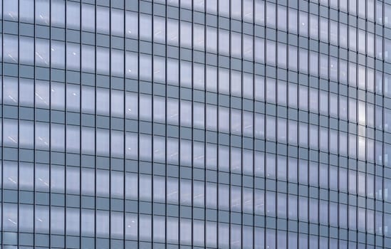 Urban abstract - window facade of business center office building with reflections and colours. Philadelphia PA USA