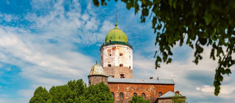 Architecture of old town Vyborg, Russia, Europe. Saint Olaf tower and Vyborg castle on summer day.