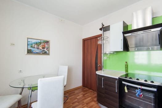 Russia, Moscow- May 17, 2019: interior room apartment. standard repair decoration in hostel. kitchen and dining room