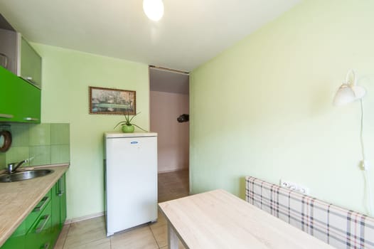Russia, Moscow- May 17, 2019: interior room apartment. standard repair decoration in hostel. kitchen and dining room