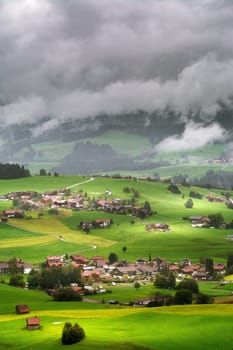 Aerial View on Obermaiselstein in the Fog. Oberallgau, Germany