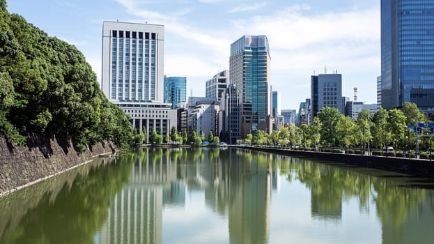 pond imperial palace Tokyo financial buldings wall