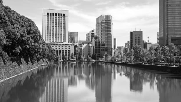 pond imperial palace Tokyo financial buldings wall black white
