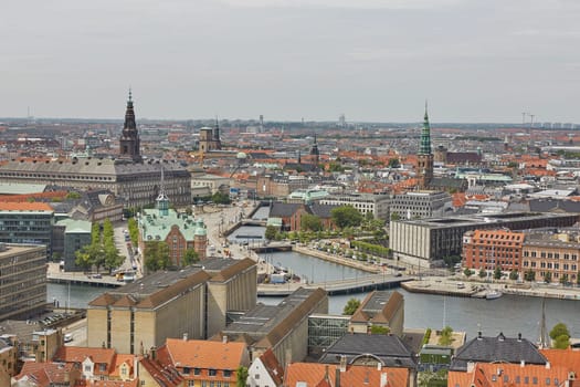 COPENHAGEN, DENMARK - JUNE 28, 2017: Skyline of scandinavian city of Copenhagen in Denmark during a cloudy day.