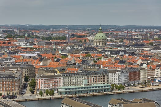 COPENHAGEN, DENMARK - JUNE 28, 2017: Skyline of scandinavian city of Copenhagen in Denmark during a cloudy day.