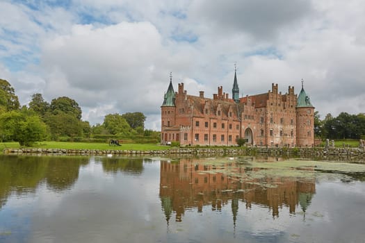 FUNEN, DENMARK - SEPTEMBER 17, 2017: Egeskov Castle is Europe's best preserved Renaissance water castle and it's located in the south of the island of Funen in Denmark