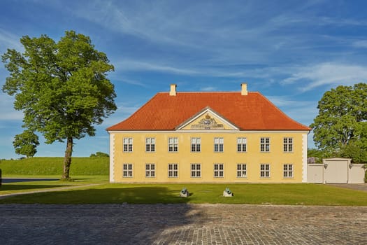 COPENHAGEN, DENMARK - MAY 25, 2017: Yellow building of Naval Association (Søofficers-Foreningen) in the historical Fortress Kastellet in Copenhagen, Denmark