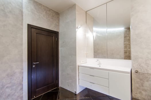 Russia, Moscow- May 20, 2019: interior room apartment. standard repair decoration in hostel. modern bathroom, sink, decoration elements, toilet.