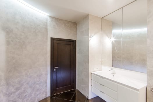 Russia, Moscow- May 20, 2019: interior room apartment. standard repair decoration in hostel. modern bathroom, sink, decoration elements, toilet.