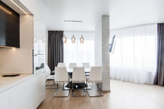 Russia, Moscow- May 20, 2019: interior room apartment. standard repair decoration in hostel. modern kitchen, dining area