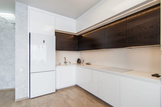 Russia, Moscow- May 20, 2019: interior room apartment. standard repair decoration in hostel. modern kitchen, dining area