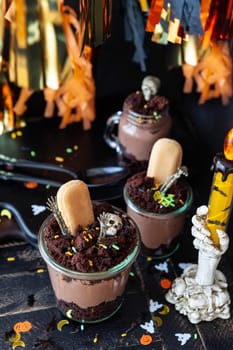 Scary dessert for Hallowen made from chocolate cake and chocolate mousse