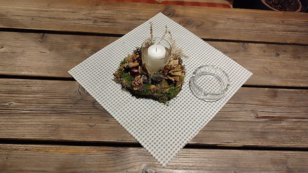 white candle candlestick ashtray wooden table objects. High quality photo